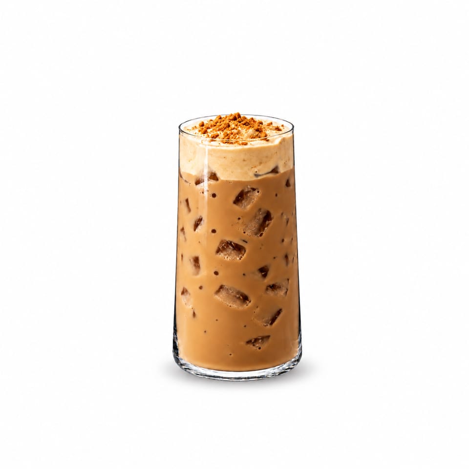 Tall glass of iced coffee topped with whipped cream and crushed cookie crumbs.